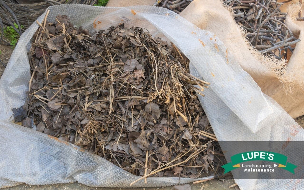 Fall yard waste including leaves and branches being prepared for composting