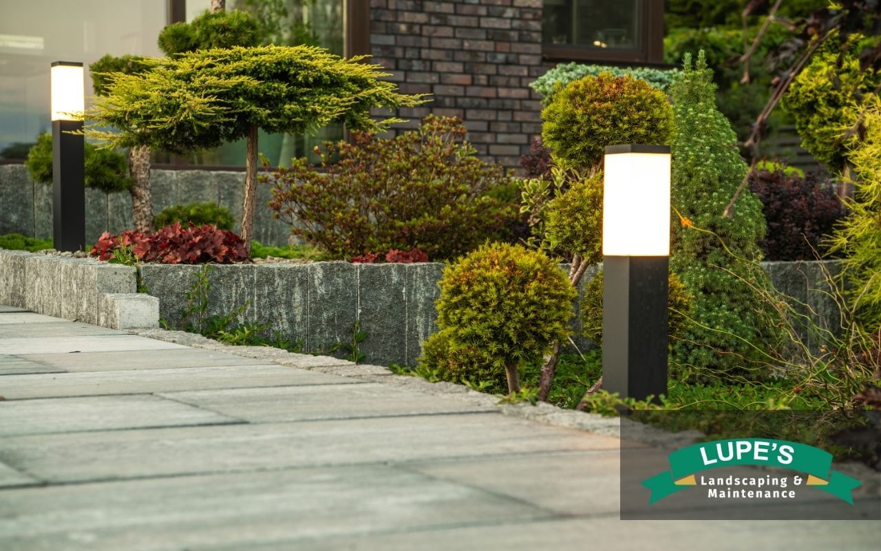 Outdoor path with staggered low-voltage lighting along walkway edges